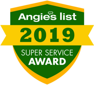 A green shield with a gold slit through the middle and outlined in gold also. The Shield displays the text "Super Service Award Winner Ten Years Running!"