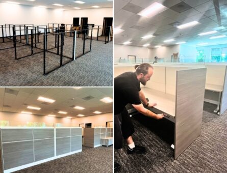 Professional office furniture installation team setting up workstations